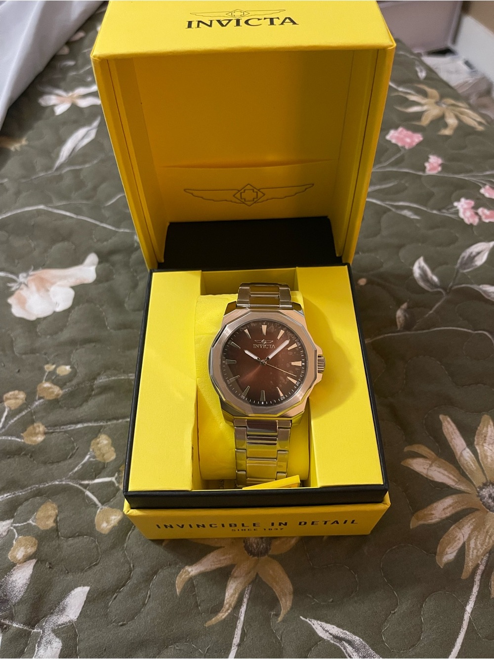 Men’s Invicta silver watch with brown faceplate